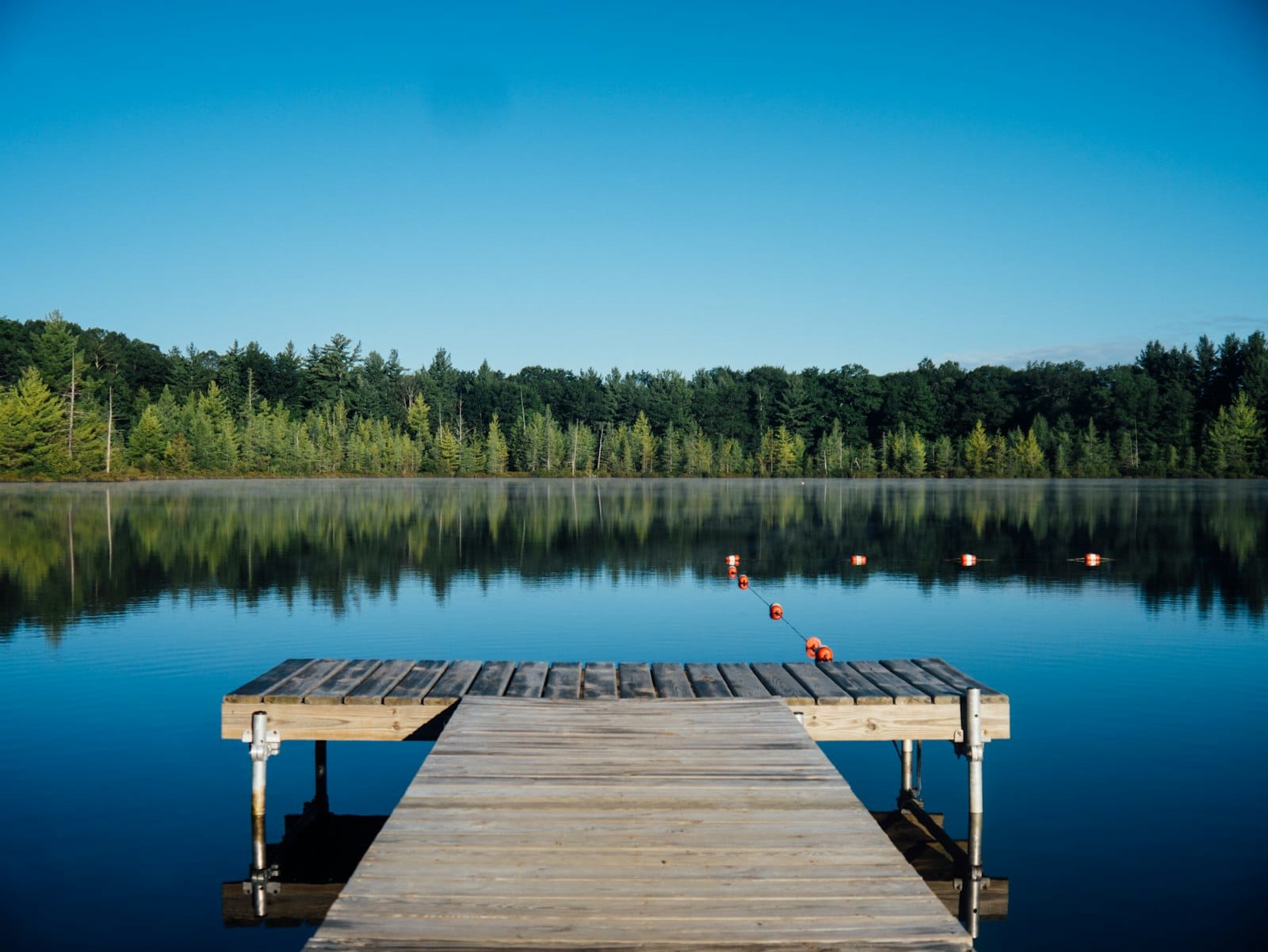Calm lake water under a wide sky