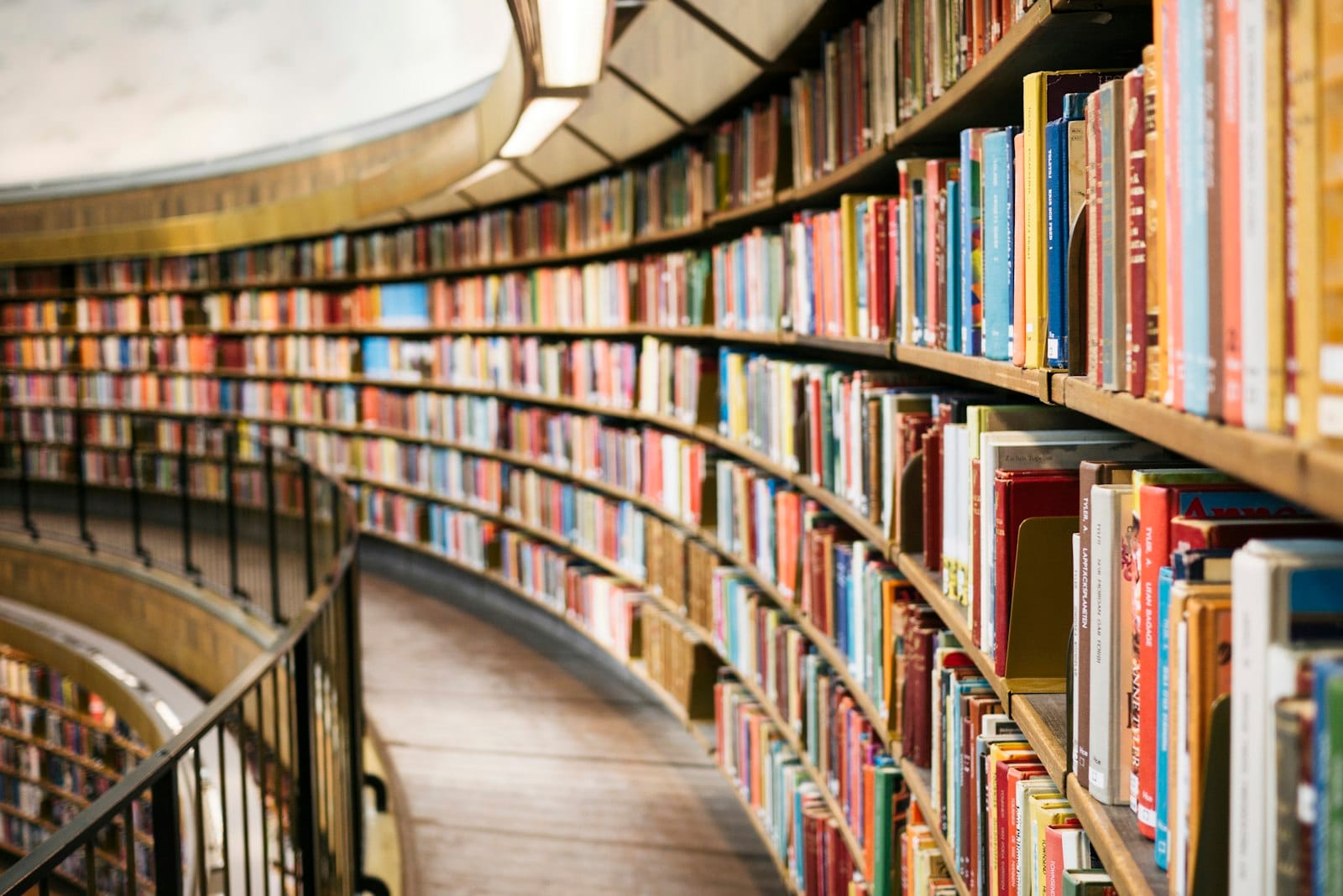 A library aisle lined with tall shelves of books